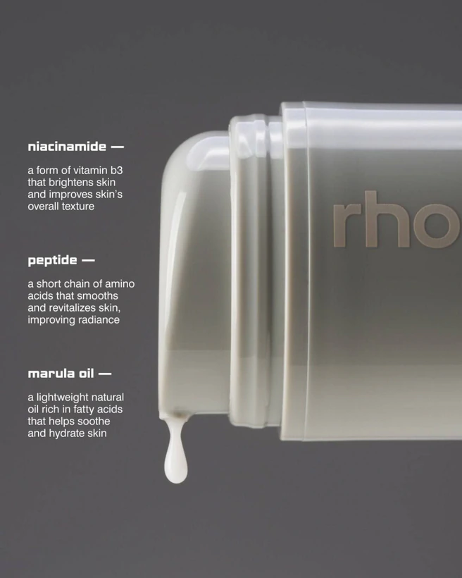 A pale tube of skincare with an ingredient list beside it.