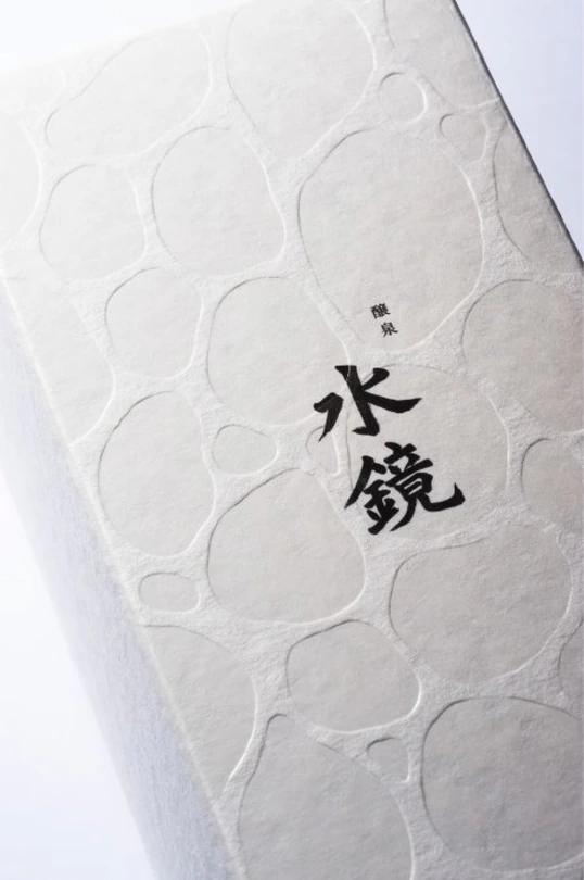 White embossed packaging with a wave texture.